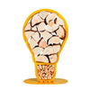 A front view of one of Ardour's light bulb shaped metal log baskets in honey yellow. It is a profile of a screw-in style light bulb attached to a base-plate. The design has two compartments; A small one at the top to store kindling and a large one for the main body of the bulb to store the logs.